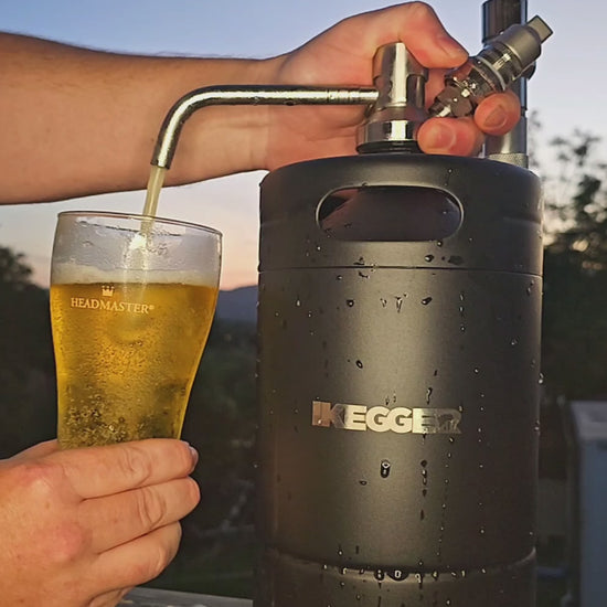 beer keg pour, the perfect way to end the day. slomo pour at sunset